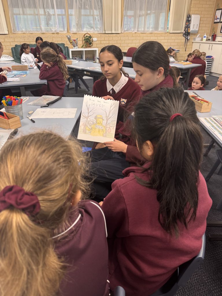 Year 9 students sharing their book titled 'Voices of the Forest' with Year 1 students