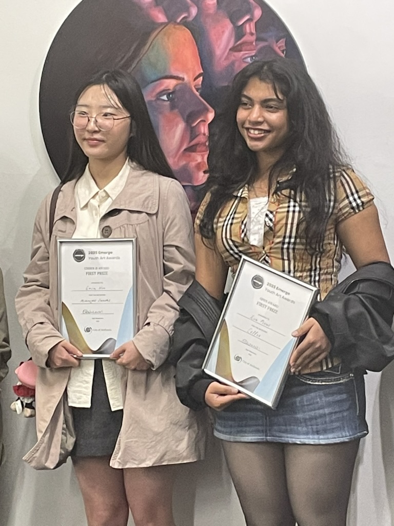 Students Erin and Eva with their certificates