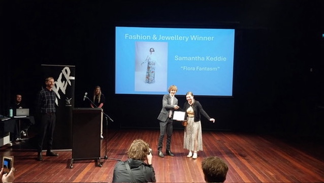 Caitlin receiving her award.