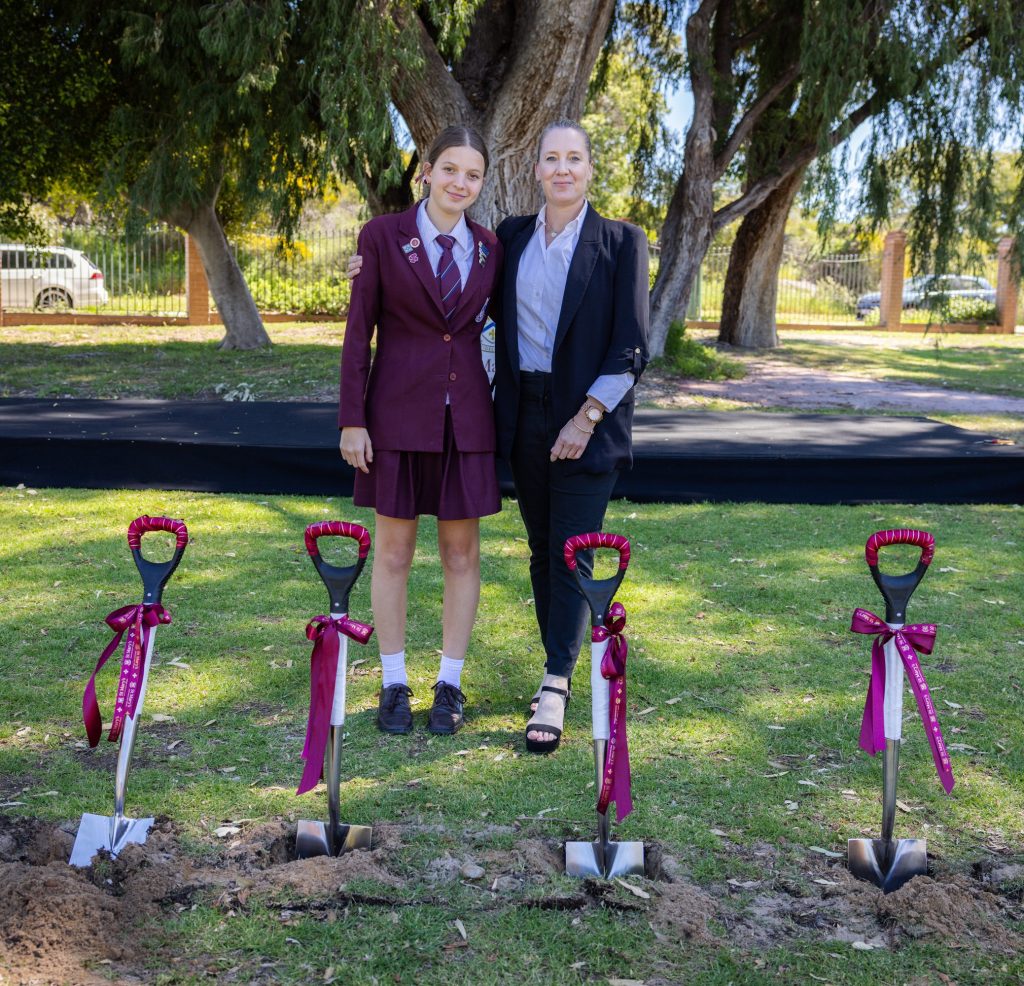 St Mary's Old Girl Simone Pastor (Turner '93) with her daughter Alexis (Year 9), posing in front of the ceremonial shovels following the sod turning event.